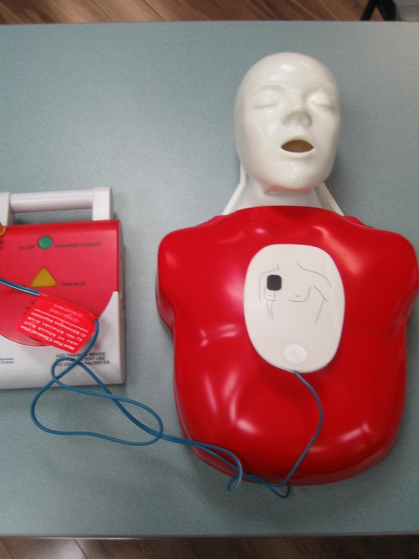 AED Trainer with Pads on Child CPR Mannequin